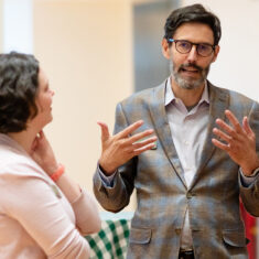 Phil Archer speaking with Museum guests in the contemporary Babcock Wing.